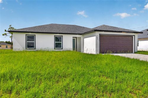 704 Carbon St E, LEHIGH ACRES, FL, 33974-9504 | Card Image