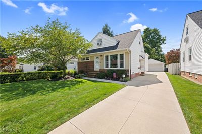 Cape cod home featuring a front lawn new driveway | Image 2