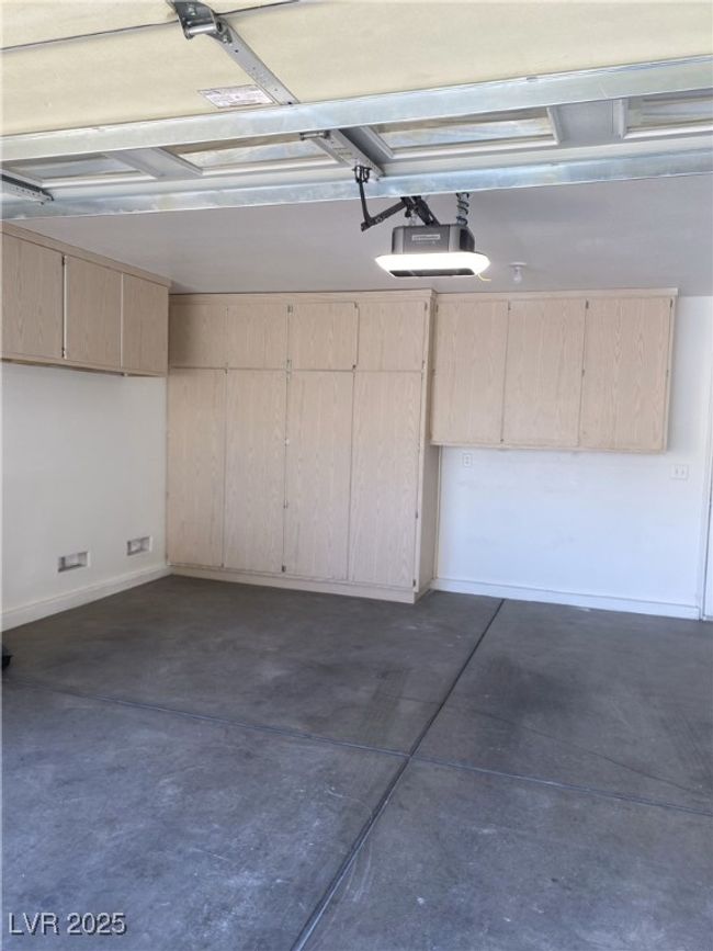 Garage with a garage door opener | Image 24