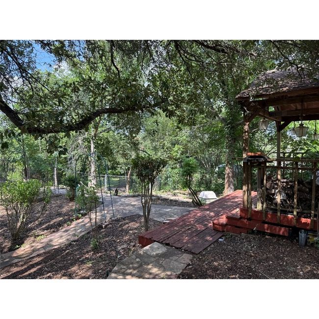 View of patio featuring a wooden deck and a gazebo | Image 4