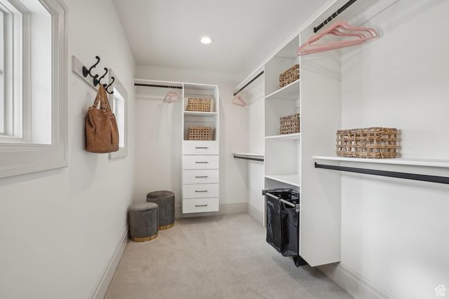 Spacious closet featuring light carpet | Image 34