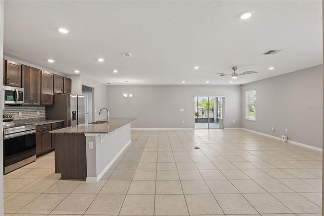 15250 Aquarius Way, House other with 3 bedrooms, 2 bathrooms and null parking in MASCOTTE FL | Image 4