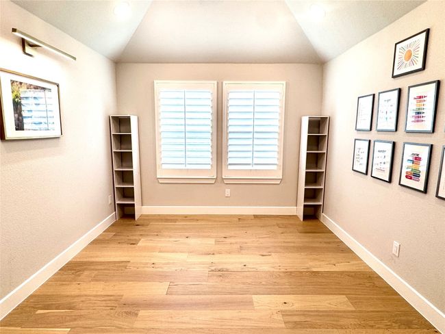Unfurnished room with lofted ceiling, light wood-type flooring, and recessed lighting | Image 34