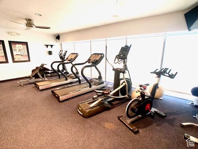 Workout area with a ceiling fan and baseboards | Image 15