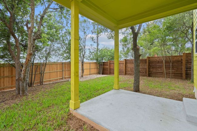 View of yard with a fenced backyard and a patio area | Image 24
