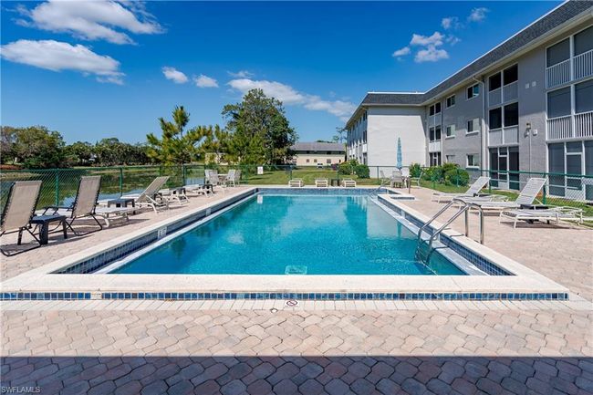 Pool with a patio and fence | Image 26