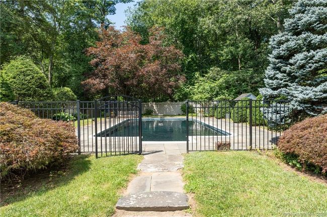 The Gunite Pool is located at the back of the property and patio surround is landscaped and fully fenced. | Image 28