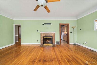 Right doorway takes you to the kitchen and left doorway goes to the hallway to two main floor bedrooms and the bathroom. | Image 3