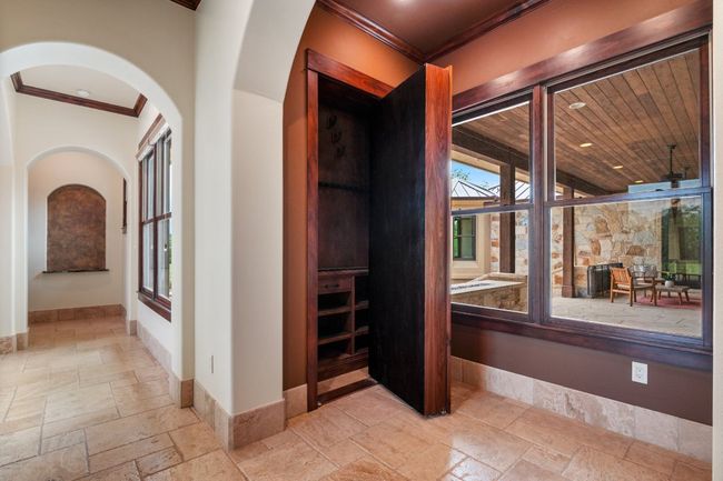 Built in bookcase, opens to expose hidden gun safe. | Image 8