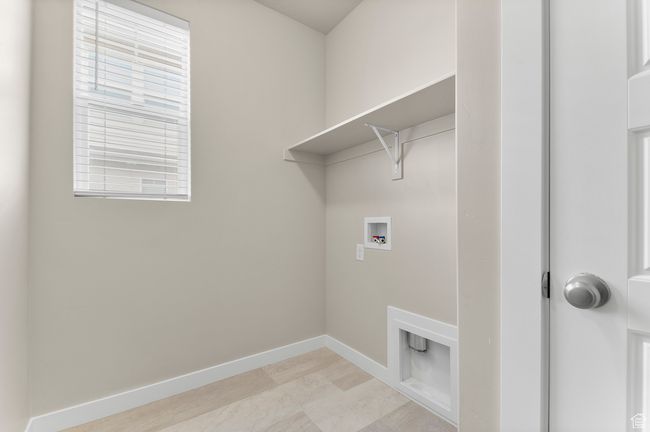 Laundry area featuring washer hookup, laundry area, and baseboards | Image 17