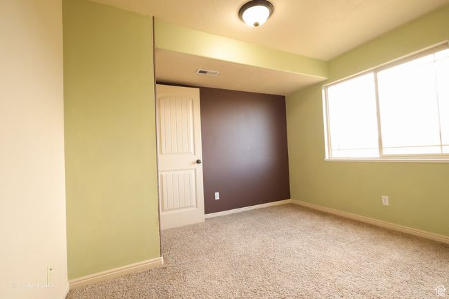 Unfurnished room featuring carpet flooring and baseboards | Image 9