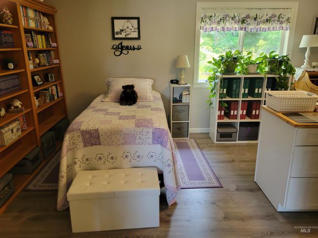 Bedroom with wood finished floors | Image 31