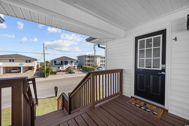 Wooden porch featuring a residential view | Image 29