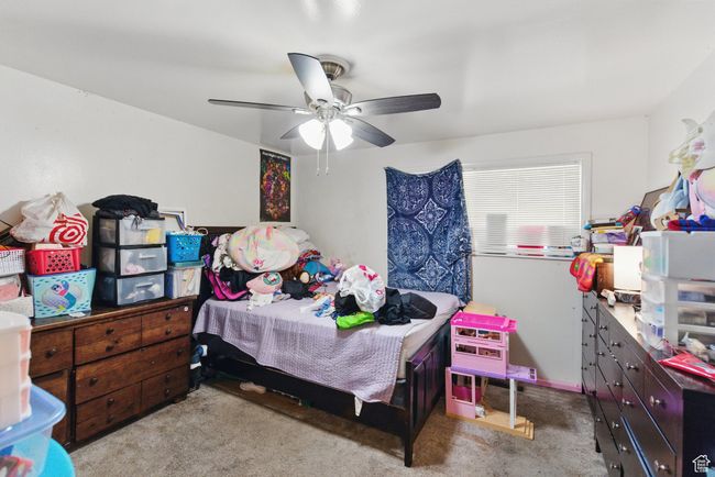 Bedroom featuring carpet and ceiling fan | Image 28