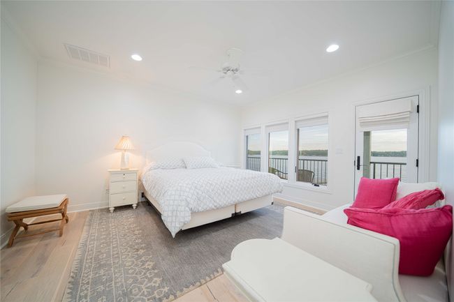 Bedroom featuring crown molding, access to exterior, wood finished floors, recessed lighting, and a ceiling fan | Image 37