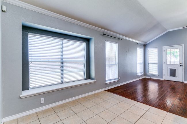 This breakfast nook is the perfect place to have your morning coffee or enjoy a meal with family or friends. The space is large enough to accommodate a table for six. | Image 10