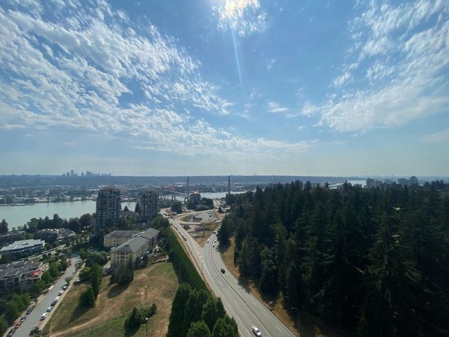 Aerial view of property's location with a highway, a large body of water, and nearby urban area | Image 19