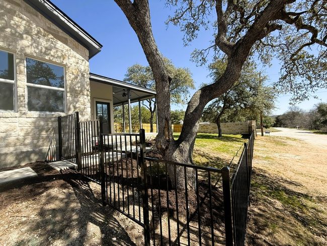 View of yard featuring fence and a patio | Image 33