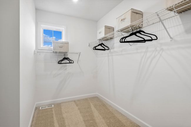 (Photo of a decorated model home, actual features may vary) Owner's walk-in closet, attached to the owner's bath! | Image 23