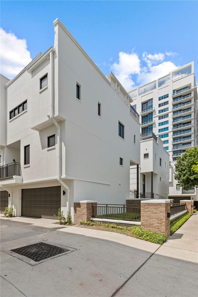 EASY ACCESS TWO-CAR ATTACHED GARAGE AT FRONT OF COMMUNITY IMMEDIATELY OFF ROAD | Image 38