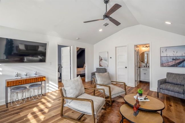 Upstairs loft space offers a comfortable living area with access to two bedrooms and a full bath—perfect for extended stays or flexible use. | Image 30