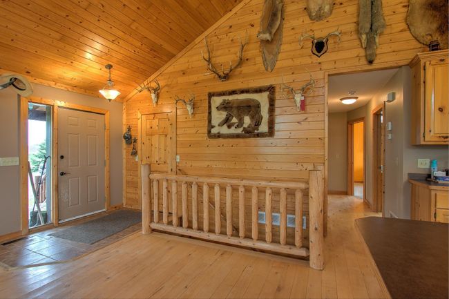 Entry with ceramic tile and generous sized closet for coats, boots, and gear. | Image 11