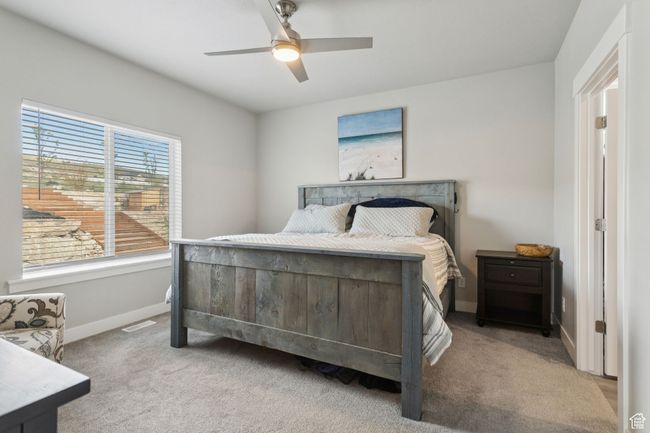 Carpeted bedroom featuring baseboards and ceiling fan | Image 24