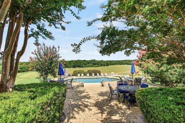 Swimming pool with a patio and outdoor dining space | Image 32