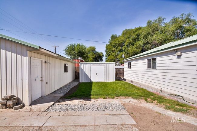 View of yard with a storage unit | Image 40