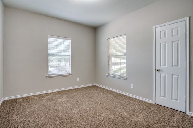 Carpeted empty room featuring plenty of natural light and baseboards | Image 14