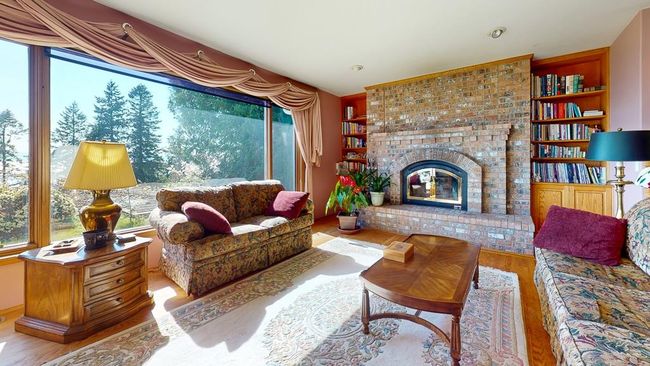 Living room showing built-in shelving | Image 21