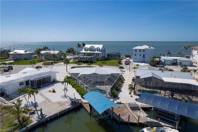 Drone / aerial view with a water view of the bay with Sanibel in the distance. | Image 28
