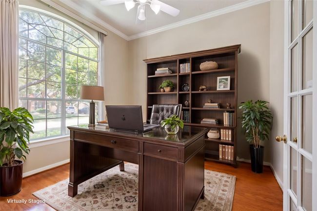Just opposite you'll find the dedicated office with a gorgeous view to the front yard through the oversized window. | Image 10