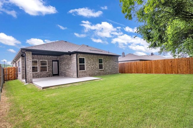 Back of property featuring a patio, a fenced backyard, brick siding, and roof with shingles | Image 27