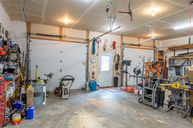 Garage with a workshop area | Image 66