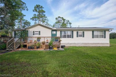 View of front of property featuring a deck. | Image 1