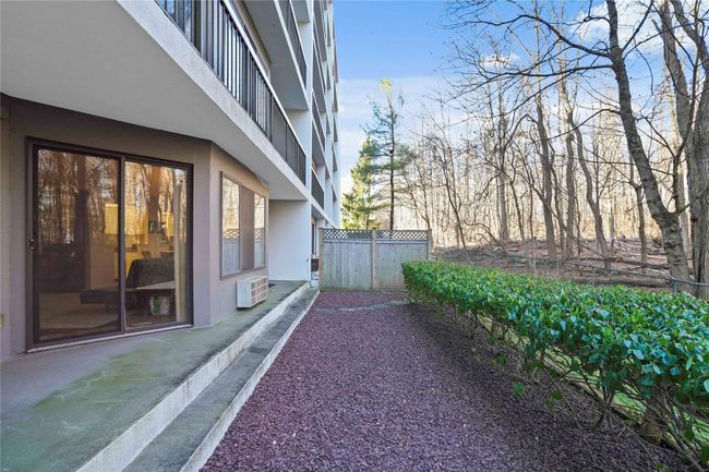 View of property exterior featuring a wall unit AC | Image 24