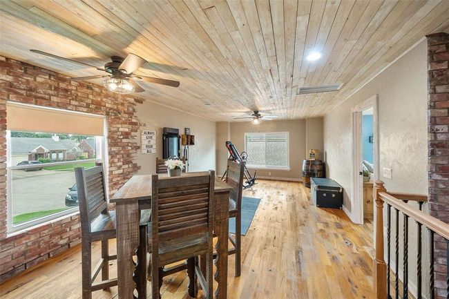 A generously sized game room offers abundant space for entertainment. | Image 32