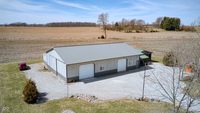 view of pole building featuring a rural view and driveway | Image 11