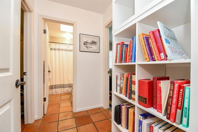 Clever and convenient built in shelving graces this hallway. | Image 41