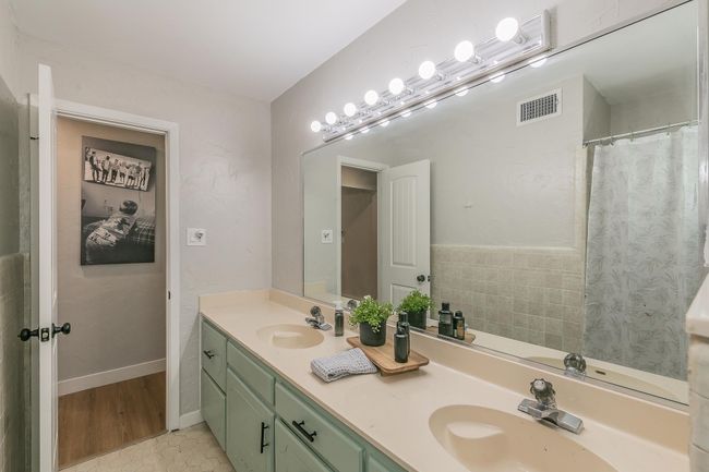 Bathroom featuring double vanity | Image 16