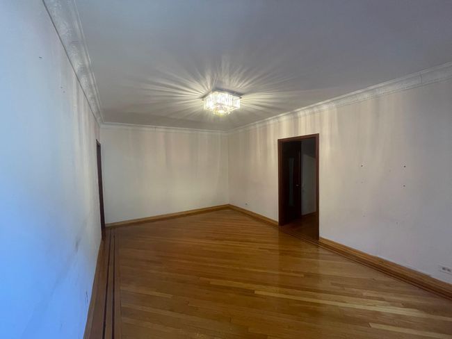 Unfurnished room with baseboards, ornamental molding, and light wood-type flooring | Image 9