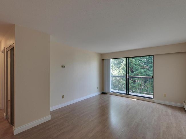 Unfurnished room with baseboards and wood finished floors | Image 6