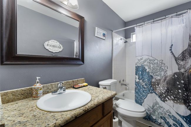 Bathroom with vanity, shower / bathtub combination and toilet | Image 19