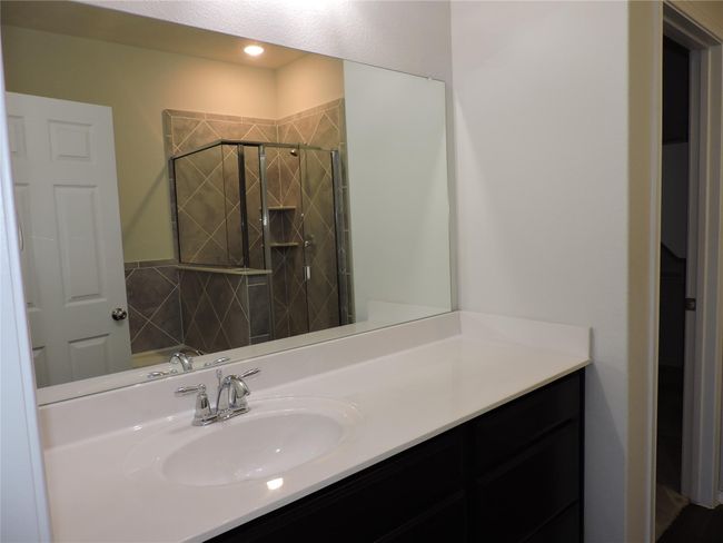 Primary Bath features quartz high vanity countertop, spacious drawers and storage below | Image 20