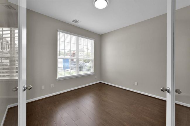 Office with french doors. Looking from the outside looking in. New wood flooring. | Image 7