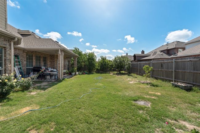 Fenced backyard featuring a patio area | Image 29