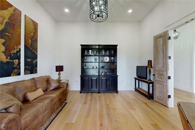 Flex room with light wood-style flooring, a chandelier, recessed lighting, and baseboards | Image 27
