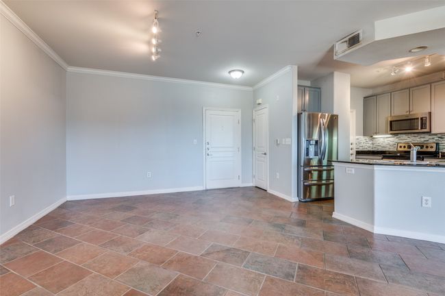 Kitchen featuring tasteful backsplash, gray cabinets, stainless steel appliances, and track lighting | Image 23