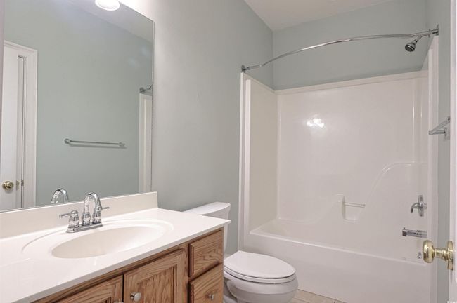 Full bath featuring vanity, shower / bath combination, and tile patterned flooring | Image 18